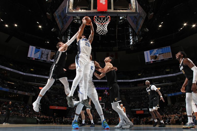 MEMPHIS, TN - JANUARY 26:  Markelle Fultz #20 of the Orlando Magic drives to the basket during the game against the Memphis Grizzlies on January 26, 2024 at FedExForum in Memphis, Tennessee. NOTE TO USER: User expressly acknowledges and agrees that, by downloading and or using this photograph, User is consenting to the terms and conditions of the Getty Images License Agreement. Mandatory Copyright Notice: Copyright 2024 NBAE (Photo by Joe Murphy/NBAE via Getty Images)