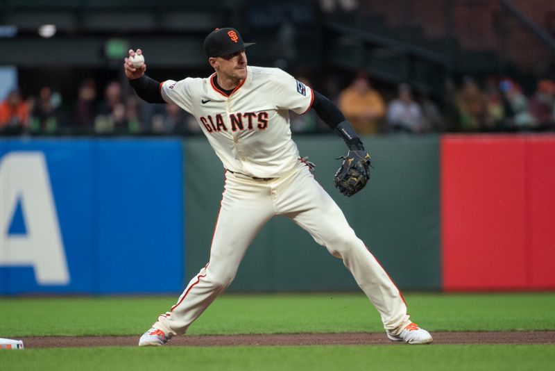 Apr 23, 2024; San Francisco, California, USA; San Francisco Giants third baseman Matt Chapman (26) throws  to first base during the third inning against the New York Mets at Oracle Park. Mandatory Credit: Ed Szczepanski-USA TODAY Sports