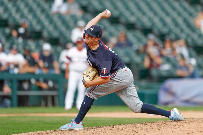 Sep 17, 2023; Chicago, Illinois, USA; Minnesota Twins relief pitcher Emilio Pagan (15) delivers a pitch against the Chicago White Sox during the ninth inning at Guaranteed Rate Field. Mandatory Credit: Kamil Krzaczynski-USA TODAY Sports