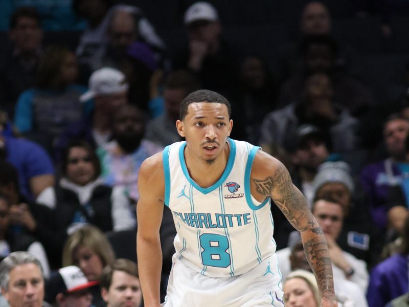 CHARLOTTE, NC - JANUARY 10: Nick Smith Jr. #8 of the Charlotte Hornets looks on during the game against the Sacramento Kings on January  10, 2024 at Spectrum Center in Charlotte, North Carolina. NOTE TO USER: User expressly acknowledges and agrees that, by downloading and or using this photograph, User is consenting to the terms and conditions of the Getty Images License Agreement.  Mandatory Copyright Notice:  Copyright 2024 NBAE (Photo by Brock Williams-Smith/NBAE via Getty Images) 