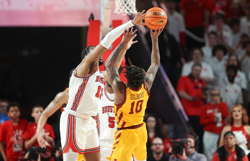 Feb 19, 2024; Houston, Texas, USA; Houston Cougars forward J'Wan Roberts (13) defends against Iowa State Cyclones guard Keshon Gilbert (10) during the second half at Fertitta Center. Mandatory Credit: Troy Taormina-USA TODAY Sports