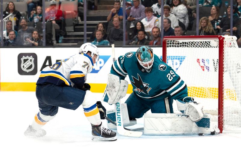 Oct 10, 2024; San Jose, California, USA;  San Jose Sharks goaltender Mackenzie Blackwood (29) defends against St. Louis Blues center Zack Bolduc (76) during the second period at SAP Center at San Jose. Mandatory Credit: Stan Szeto-Imagn Images