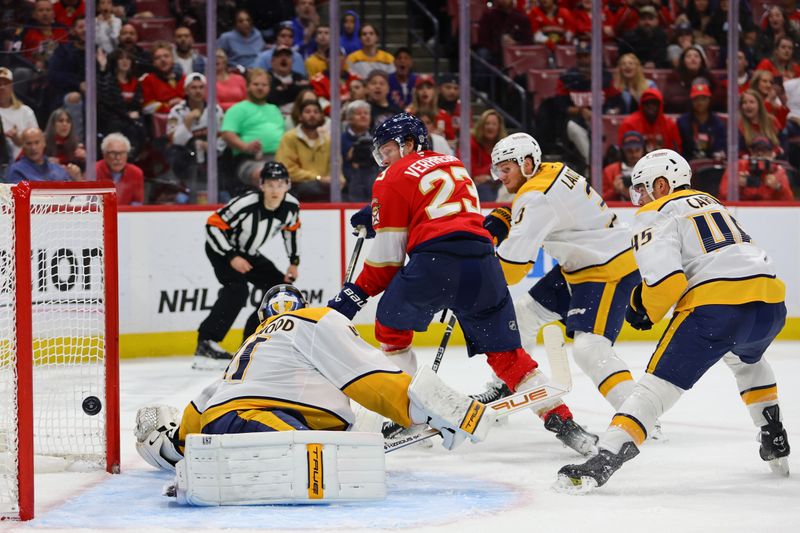 Nov 7, 2024; Sunrise, Florida, USA; Florida Panthers center Carter Verhaeghe (23) scores against Nashville Predators goaltender Scott Wedgewood (41) during the second period at Amerant Bank Arena. Mandatory Credit: Sam Navarro-Imagn Images