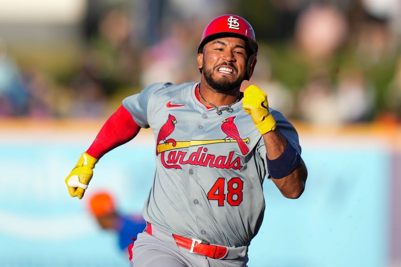 Mar 19, 2024; Port St. Lucie, Florida, USA; St. Louis Cardinals center fielder Ivan Herrera (48) runs second base after hitting a triple against the New York Mets during the second inning at Clover Park. Mandatory Credit: Rich Storry-USA TODAY Sports