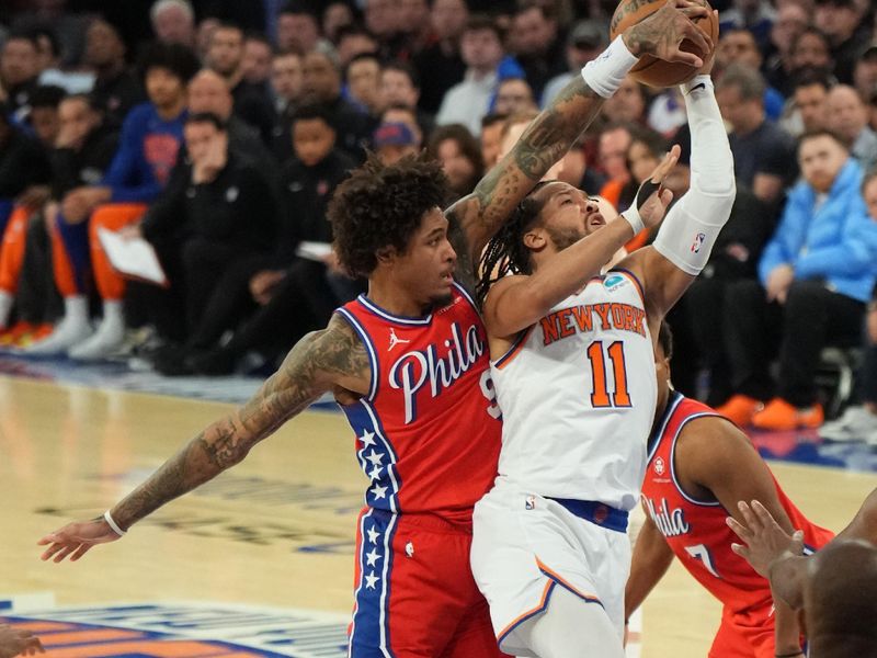 NEW YORK, NY - APRIL 20: Kelly Oubre Jr. #9 of the Philadelphia 76ers blocks Jalen Brunson #11 of the New York Knicks during the game during Round 1 Game 1 of the 2024 NBA Playoffs on April 20, 2024 at Madison Square Garden in New York City, New York.  NOTE TO USER: User expressly acknowledges and agrees that, by downloading and or using this photograph, User is consenting to the terms and conditions of the Getty Images License Agreement. Mandatory Copyright Notice: Copyright 2024 NBAE  (Photo Jesse D. Garrabrant/NBAE via Getty Images)