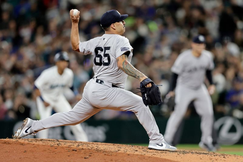 Sep 18, 2024; Seattle, Washington, USA; New York Yankees starting pitcher Nestor Cortes (65) throws against the Seattle Mariners during the fourth inning at T-Mobile Park. Mandatory Credit: John Froschauer-Imagn Images