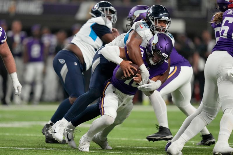 Tennessee Titans linebacker Caleb Murphy (42) sacks Minnesota Vikings quarterback Jaren Hall (16) in the second half of a preseason NFL football game, Saturday, Aug. 19, 2023, in Minneapolis. (AP Photo/Charlie Neibergall)