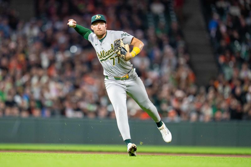 Jul 30, 2024; San Francisco, California, USA;  Oakland Athletics third baseman Brett Harris (77) throws out San Francisco Giants left fielder Derek Hill (not pictured) during the eighth inning at Oracle Park. Mandatory Credit: Neville E. Guard-USA TODAY Sports