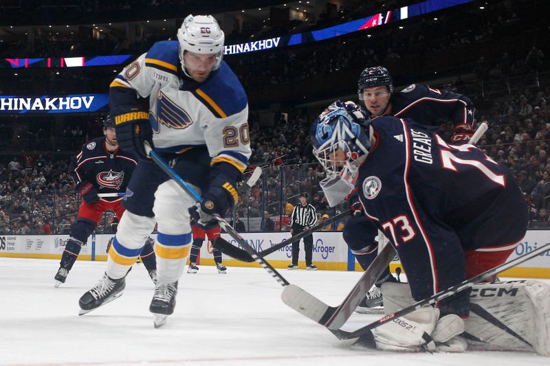 Dec 8, 2023; Columbus, Ohio, USA; St. Louis Blues left wing Brandon Saad (20) reaches for the puck as Columbus Blue Jackets goalie Jet Greaves (73) makes the save during the third period at Nationwide Arena. Mandatory Credit: Russell LaBounty-USA TODAY Sports