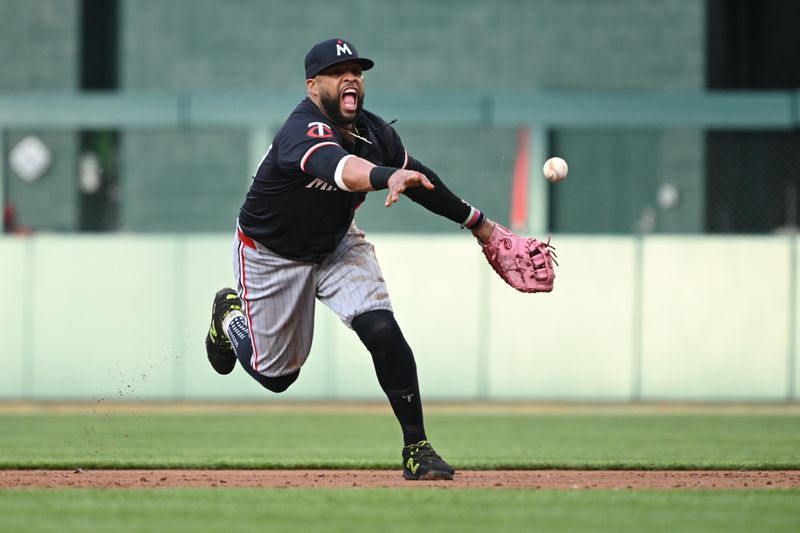 May 20, 2024; Washington, District of Columbia, USA; Minnesota Twins first base Carlos Santana (30) tosses the ball to first base after fielding a ground ball against the Washington Nationals during the second inning at Nationals Park. Mandatory Credit: Rafael Suanes-USA TODAY Sports