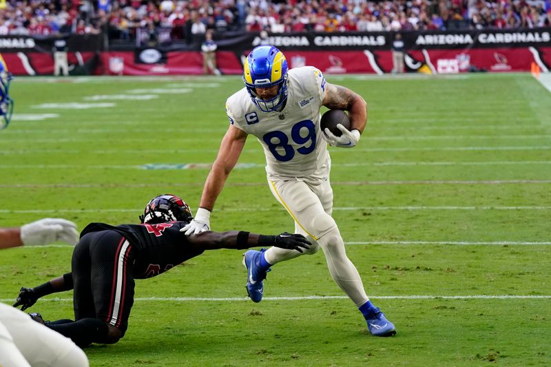 Los Angeles Rams tight end Tyler Higbee scores a touchdown during the first half of an NFL football game against the Arizona Cardinals, Sunday, Nov. 26, 2023, in Glendale, Ariz. (AP Photo/Ross D. Franklin)