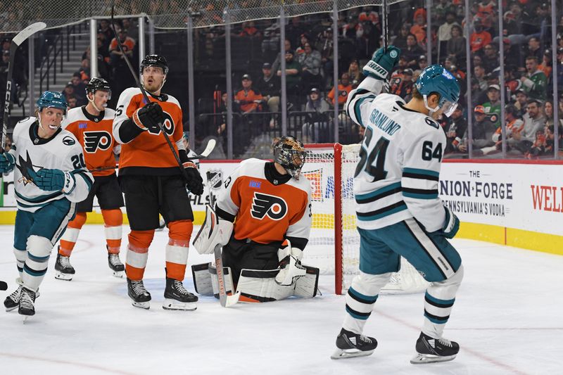 Nov 11, 2024; Philadelphia, Pennsylvania, USA; San Jose Sharks center Mikael Granlund (64) celebrates his goal  against Philadelphia Flyers goaltender Samuel Ersson (33) during the second period at Wells Fargo Center. Mandatory Credit: Eric Hartline-Imagn Images