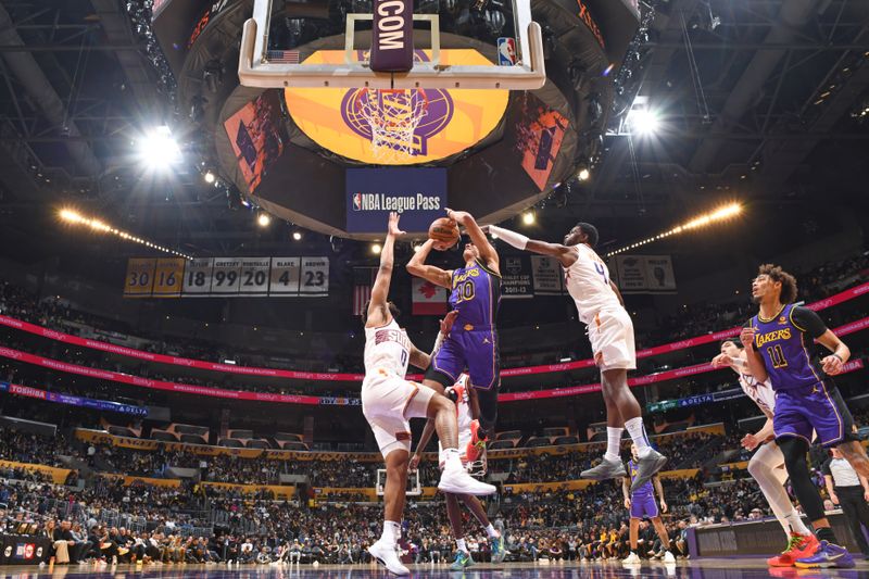 LOS ANGELES, CA - JANUARY 11: Max Christie #10 of the Los Angeles Lakers drives to the basket during the game against the Phoenix Suns on January 11, 2024 at Crypto.Com Arena in Los Angeles, California. NOTE TO USER: User expressly acknowledges and agrees that, by downloading and/or using this Photograph, user is consenting to the terms and conditions of the Getty Images License Agreement. Mandatory Copyright Notice: Copyright 2024 NBAE (Photo by Andrew D. Bernstein/NBAE via Getty Images)