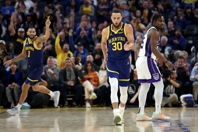 SAN FRANCISCO, CALIFORNIA - JANUARY 25: Stephen Curry #30 of the Golden State Warriors reacts after he made a three-point basket on Davion Mitchell #15 of the Sacramento Kings in the first half at Chase Center on January 25, 2024 in San Francisco, California. NOTE TO USER: User expressly acknowledges and agrees that, by downloading and or using this photograph, User is consenting to the terms and conditions of the Getty Images License Agreement.  (Photo by Ezra Shaw/Getty Images)