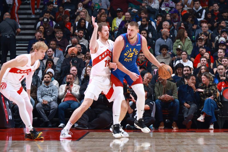 TORONTO, CANADA - OCTOBER 28: Nikola Jokic #15 of the Denver Nuggets dribbles the ball during the game against the Toronto Raptors on October 28, 2024 at the Scotiabank Arena in Toronto, Ontario, Canada.  NOTE TO USER: User expressly acknowledges and agrees that, by downloading and or using this Photograph, user is consenting to the terms and conditions of the Getty Images License Agreement.  Mandatory Copyright Notice: Copyright 2024 NBAE (Photo by Vaughn Ridley/NBAE via Getty Images)