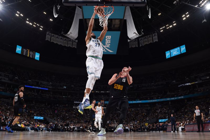 DENVER, CO - MAY 19:  Rudy Gobert #27 of the Minnesota Timberwolves slam dunk the ball during the game  against the Denver Nuggets during Round 2 Game 7 of the 2024 NBA Playoffs  on May 19, 2024 at the Ball Arena in Denver, Colorado. NOTE TO USER: User expressly acknowledges and agrees that, by downloading and/or using this Photograph, user is consenting to the terms and conditions of the Getty Images License Agreement. Mandatory Copyright Notice: Copyright 2024 NBAE (Photo by Garrett Ellwood/NBAE via Getty Images)