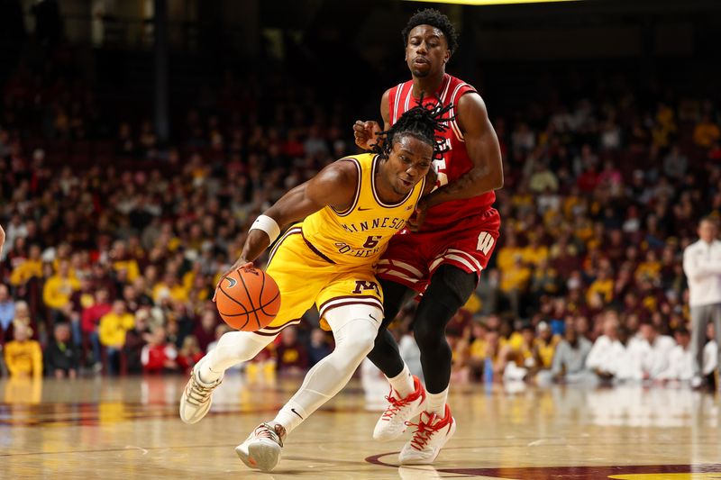 Jan 13, 2026; Minneapolis, Minnesota, USA; Minnesota Golden Gophers guard Langston Reynolds (6) works around Wisconsin Badgers guard John Blackwell (25) during the first half at Williams Arena. Mandatory Credit: Matt Krohn-Imagn Images