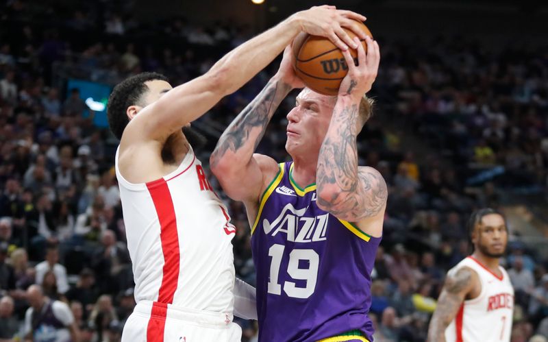 SALT LAKE CITY, UT - APRIL 11: Luka Samanic #19  of the Utah Jazz has a shot blocked by Fred Vanvleet #5 of Houston Rockets  during the second half of their game at the Delta Center on April 11, 2024 in Salt Lake City, Utah. NOTE TO USER: User expressly acknowledges and agrees that, by downloading and or using this photograph, User is consenting to the terms and conditions of the Getty Images License Agreement. Photo by Chris Gardner/Getty Images)