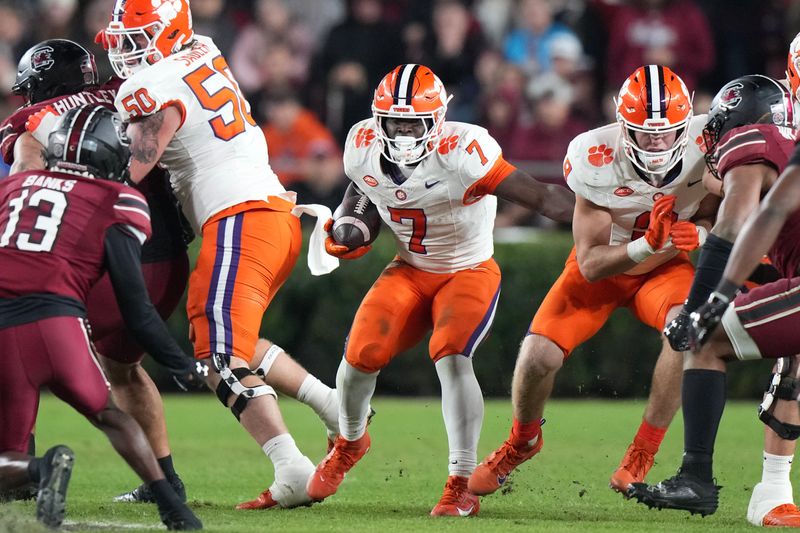 Nov 25, 2023; Columbia, South Carolina, USA; Clemson Tigers running back Phil Mafah (7) runs the ball against the South Carolina Gamecocks in the second half at Williams-Brice Stadium. Mandatory Credit: David Yeazell-USA TODAY Sports