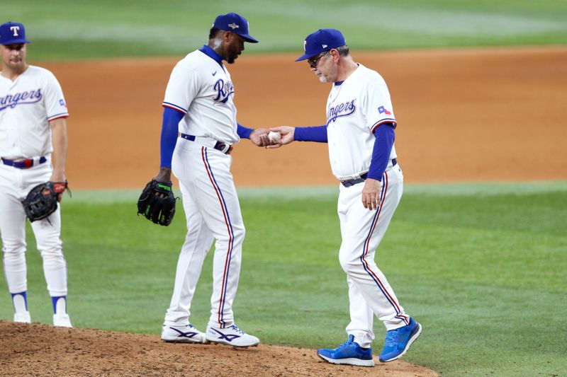 Oct 10, 2023; Arlington, Texas, USA; Texas Rangers manager Bruce Bochy (15) relieves relief pitcher Aroldis Chapman (45) in the eighth inning against the Baltimore Orioles during game three of the ALDS for the 2023 MLB playoffs at Globe Life Field. Mandatory Credit: Andrew Dieb-USA TODAY Sports