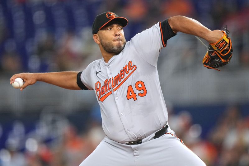 Jul 23, 2024; Miami, Florida, USA;  Baltimore Orioles starting pitcher Albert Suárez (49) pitches against the Miami Marlins in the first inning at loanDepot Park. Mandatory Credit: Jim Rassol-USA TODAY Sports