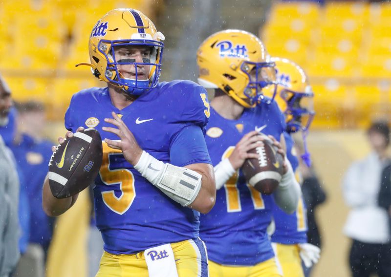 Sep 23, 2023; Pittsburgh, Pennsylvania, USA; Pittsburgh Panthers quarterbacks Phil Jurkovec (5) and Christian Veilleux (11) warms up before the game against the North Carolina Tar Heels at Acrisure Stadium. Mandatory Credit: Charles LeClaire-USA TODAY Sports