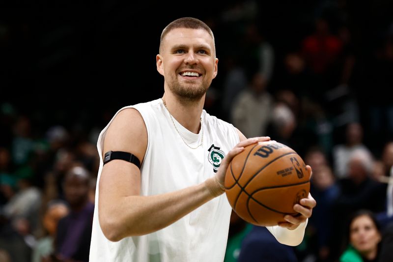 BOSTON, MA - NOVEMBER 16: Kristaps Porzingis #8 of the Boston Celtics smiles as he warms up before the game between the Boston Celtics and the Toronto Raptors at TD Garden on November 16, 2024 in Boston, Massachusetts. NOTE TO USER: User expressly acknowledges and agrees that, by downloading and/or using this Photograph, user is consenting to the terms and conditions of the Getty Images License Agreement. (Photo By Winslow Townson/Getty Images)