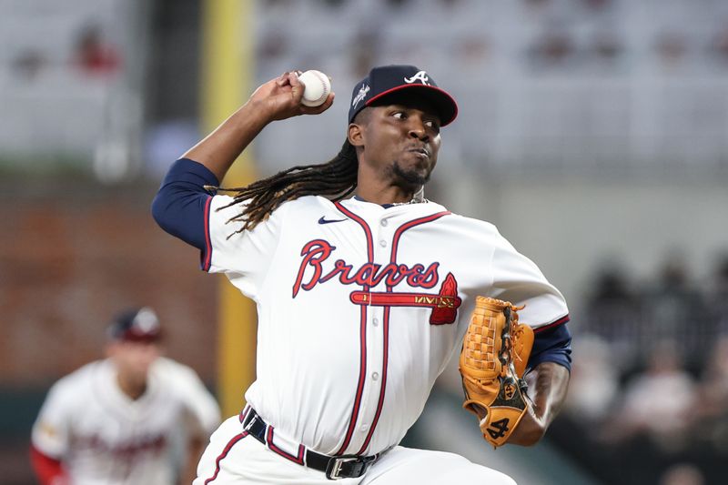 May 6, 2025; Cumberland, Georgia, USA; Atlanta Braves pitcher Rafael Montero (48) pitches the ball against the Atlanta Braves during the ninth inning at Truist Park. Mandatory Credit: Jordan Godfree-Imagn Images
