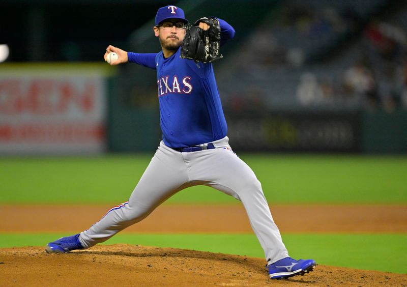 Sep 27, 2023; Anaheim, California, USA;  Texas Rangers starting pitcher Dane Dunning (33) throws to the plate in the second inning against the Los Angeles Angels at Angel Stadium. Mandatory Credit: Jayne Kamin-Oncea-USA TODAY Sports