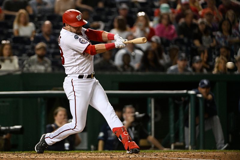 Apr 4, 2023; Washington, District of Columbia, USA; Washington Nationals right fielder Lane Thomas (28) hits an RBI single against the Tampa Bay Rays during the fourth inning at Nationals Park. Mandatory Credit: Brad Mills-USA TODAY Sports