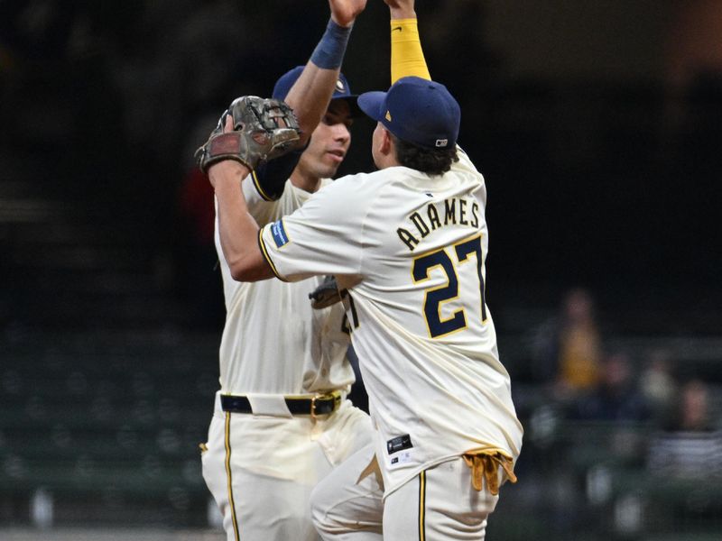 May 14, 2024; Milwaukee, Wisconsin, USA; Milwaukee Brewers outfielder Christian Yelich (22) and Milwaukee Brewers catcher William Contreras (24) celebrate a 4-3 win over the Pittsburgh Pirates at American Family Field. Mandatory Credit: Michael McLoone-USA TODAY Sports