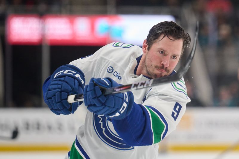 Nov 2, 2024; San Jose, California, USA; Vancouver Canucks center J.T. Miller (9) warms up on the ice before the game between the Vancouver Canucks and the San Jose Sharks at SAP Center at San Jose. Mandatory Credit: Robert Edwards-Imagn Images