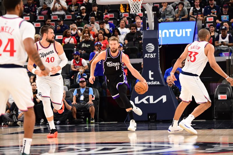 INGLEWOOD, CA - OCTOBER 17: Domantas Sabonis #11 of the Sacramento Kings dribbles the ball during the game against the LA Clippers during a NBA Preseason game on October 17, 2024 at Intuit Dome in Los Angeles, California. NOTE TO USER: User expressly acknowledges and agrees that, by downloading and/or using this Photograph, user is consenting to the terms and conditions of the Getty Images License Agreement. Mandatory Copyright Notice: Copyright 2024 NBAE (Photo by Adam Pantozzi/NBAE via Getty Images)