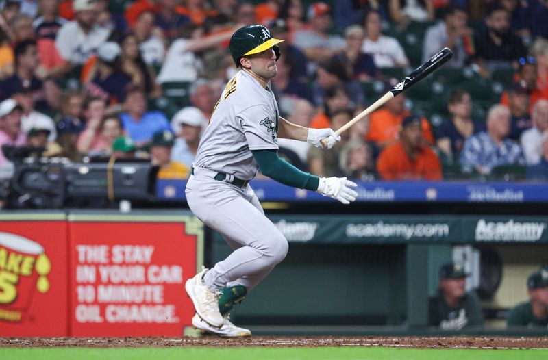 Sep 11, 2023; Houston, Texas, USA; Oakland Athletics third baseman Kevin Smith (4) hits a double during the fifth inning against the Houston Astros at Minute Maid Park. Mandatory Credit: Troy Taormina-USA TODAY Sports