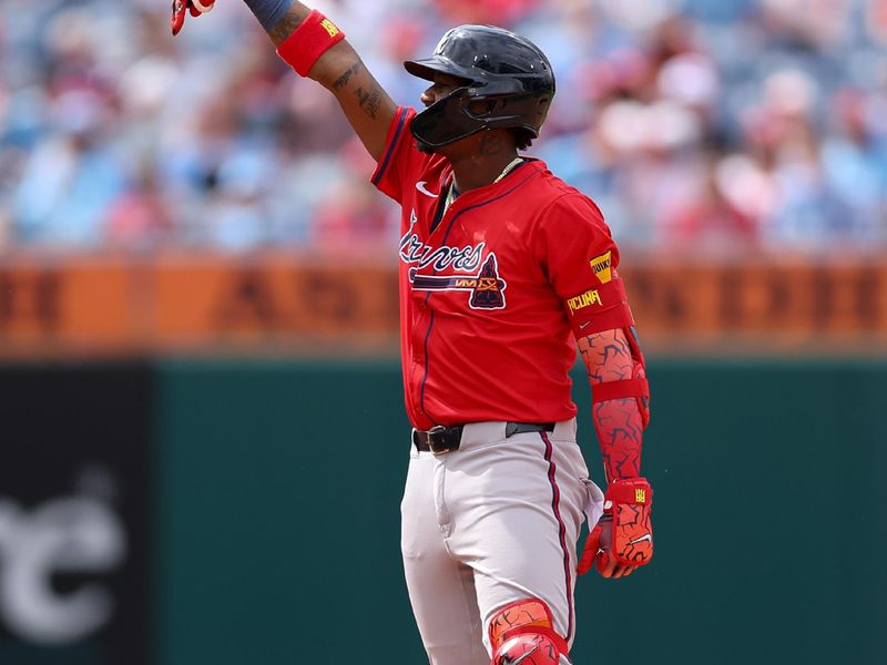May 29, 2025; Philadelphia, Pennsylvania, USA; Atlanta Braves outfielder Ronald Acuña Jr. (13) reacts after hitting a double during the eighth inning against the Philadelphia Phillies at Citizens Bank Park. Mandatory Credit: Bill Streicher-Imagn Images