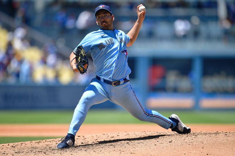 Jul 26, 2023; Los Angeles, California, USA; Toronto Blue Jays starting pitcher Yusei Kikuchi (16) throws against the Los Angeles Dodgers. during the third inning at Dodger Stadium. Mandatory Credit: Gary A. Vasquez-USA TODAY Sports