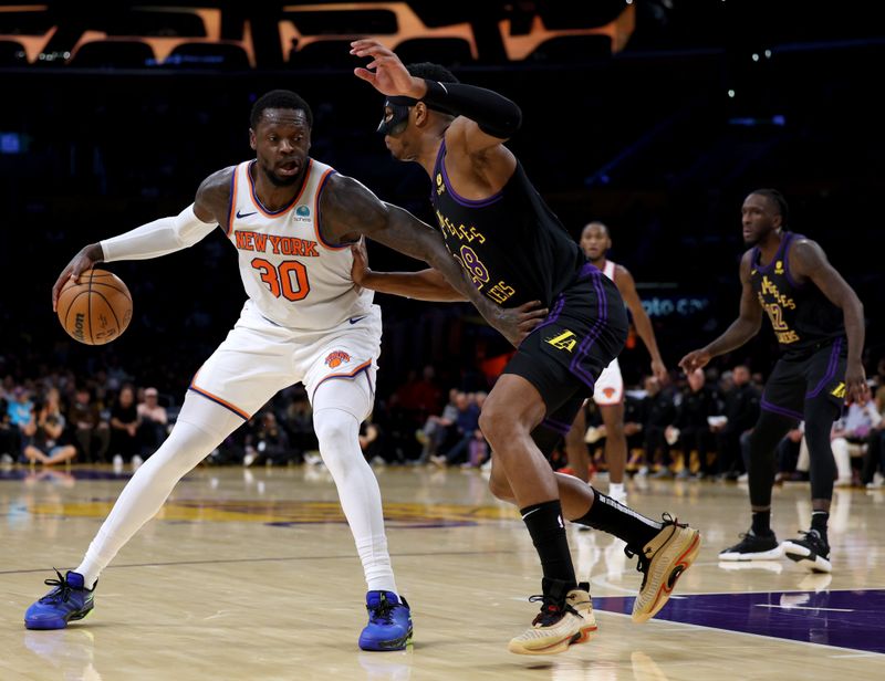 LOS ANGELES, CALIFORNIA - DECEMBER 18: Julius Randle #30 of the New York Knicks post up Rui Hachimura #28 of the Los Angeles Lakers during the first half at Crypto.com Arena on December 18, 2023 in Los Angeles, California. NOTE TO USER: User expressly acknowledges and agrees that, by downloading and or using this photograph, User is consenting to the terms and conditions of the Getty Images License Agreement. (Photo by Harry How/Getty Images)