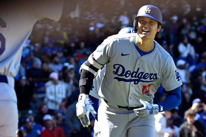 Apr 5, 2024; Chicago, Illinois, USA;  Los Angeles Dodgers two-way player Shohei Ohtani (17) reacts after hitting a two-run home run against the Chicago Cubs during the fifth inning at Wrigley Field. Mandatory Credit: Matt Marton-USA TODAY Sports