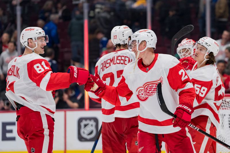 Feb 13, 2023; Vancouver, British Columbia, CAN;Detroit Red Wings forward Dominik Kubalik (81) and defenseman Gustav Lindstrom (28) celebrate the victory over the Vancouver Canucks at Rogers Arena. Red Wings won 6-1. Mandatory Credit: Bob Frid-USA TODAY Sports