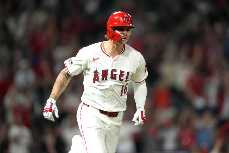 Aug 31, 2024; Anaheim, California, USA; Los Angeles Angels center fielder Mickey Moniak (16) celebrates after hitting a walk-off home run in the ninth inning against the Seattle Mariners at Angel Stadium. Mandatory Credit: Kirby Lee-USA TODAY Sports