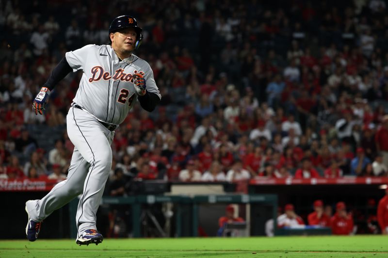Sep 16, 2023; Anaheim, California, USA;  Detroit Tigers designated hitter Miguel Cabrera (24) hits an RBI single during the tenth inning against the Los Angeles Angels at Angel Stadium. Mandatory Credit: Kiyoshi Mio-USA TODAY Sports