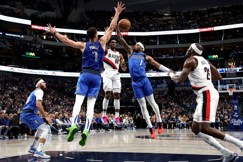 DALLAS, TEXAS - JANUARY 05: Scoot Henderson #00 of the Portland Trail Blazers passes the ball against Dwight Powell #7 of the Dallas Mavericks and Jaden Hardy #1 of the Dallas Mavericks in the first half at American Airlines Center on January 05, 2024 in Dallas, Texas. NOTE TO USER: User expressly acknowledges and agrees that, by downloading and or using this photograph, User is consenting to the terms and conditions of the Getty Images License Agreement. (Photo by Tim Heitman/Getty Images)