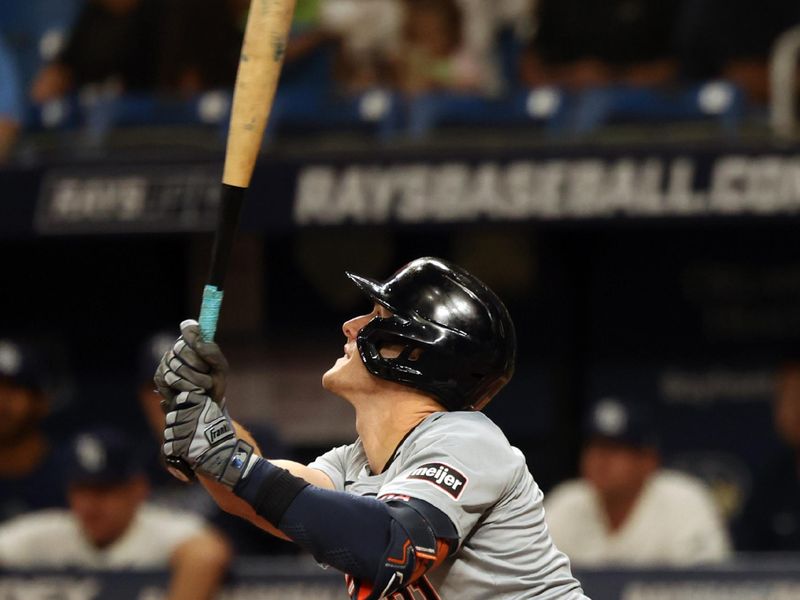 Apr 22, 2024; St. Petersburg, Florida, USA; Detroit Tigers outfielder Mark Canha (21) singles during the sixth inning against the Tampa Bay Rays at Tropicana Field. Mandatory Credit: Kim Klement Neitzel-USA TODAY Sports