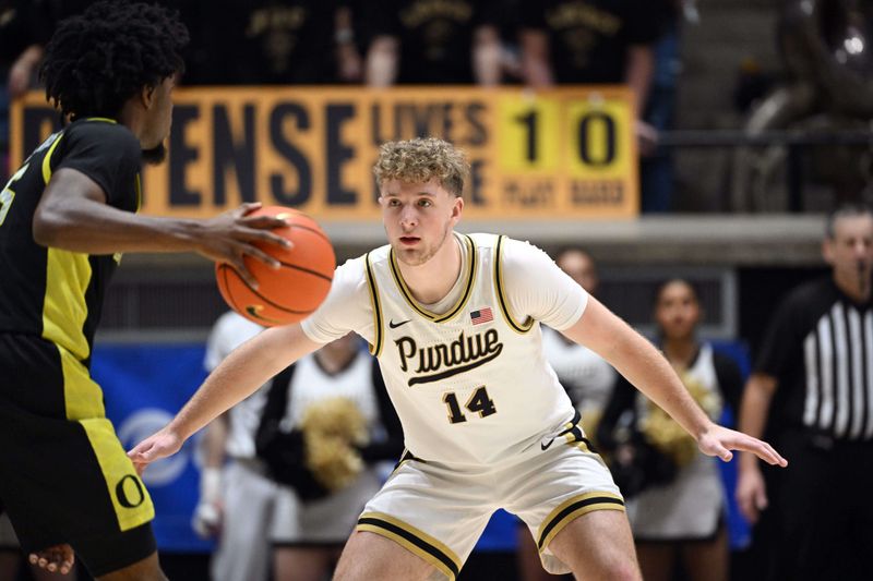 Feb 7, 2026; West Lafayette, Indiana, USA; Purdue Boilermakers guard Jack Benter (14) defends against Oregon Ducks guard Takai Simpkins (5) during the second half at Mackey Arena. Mandatory Credit: Marc Lebryk-Imagn Images