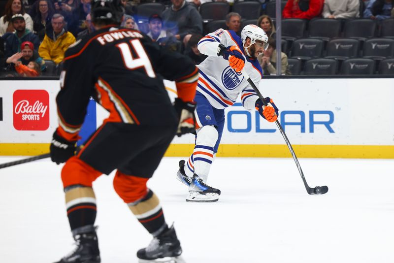 Feb 9, 2024; Anaheim, California, USA; Edmonton Oilers left wing Evander Kane (91) shoots the puck during the first period of a game against the Anaheim Ducks at Honda Center. Mandatory Credit: Jessica Alcheh-USA TODAY Sports