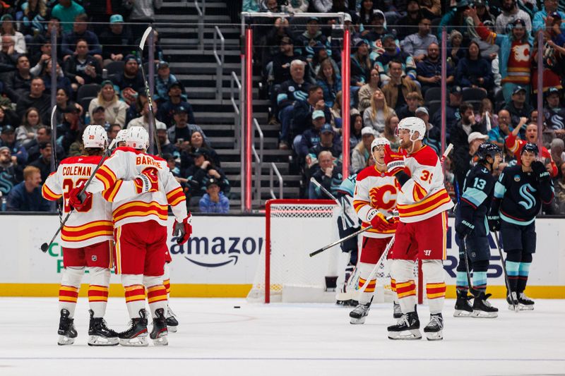 Oct 19, 2024; Seattle, Washington, USA; Calgary Flames center Blake Coleman (20) celebrates with teammates after scoring a goal against the Seattle Kraken during the first period at Climate Pledge Arena. Mandatory Credit: Caean Couto-Imagn Images