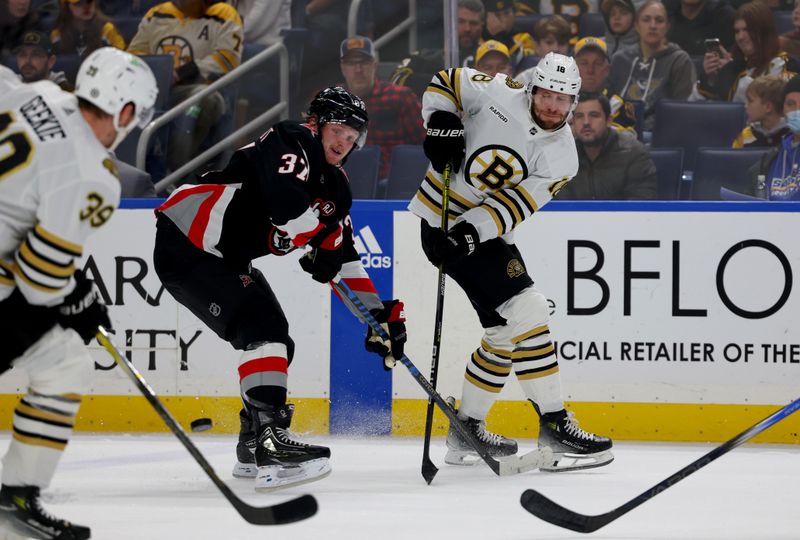 Dec 27, 2023; Buffalo, New York, USA;  Buffalo Sabres center Casey Mittelstadt (37) tries to block a pass by Boston Bruins center Pavel Zacha (18) during the first period at KeyBank Center. Mandatory Credit: Timothy T. Ludwig-USA TODAY Sports