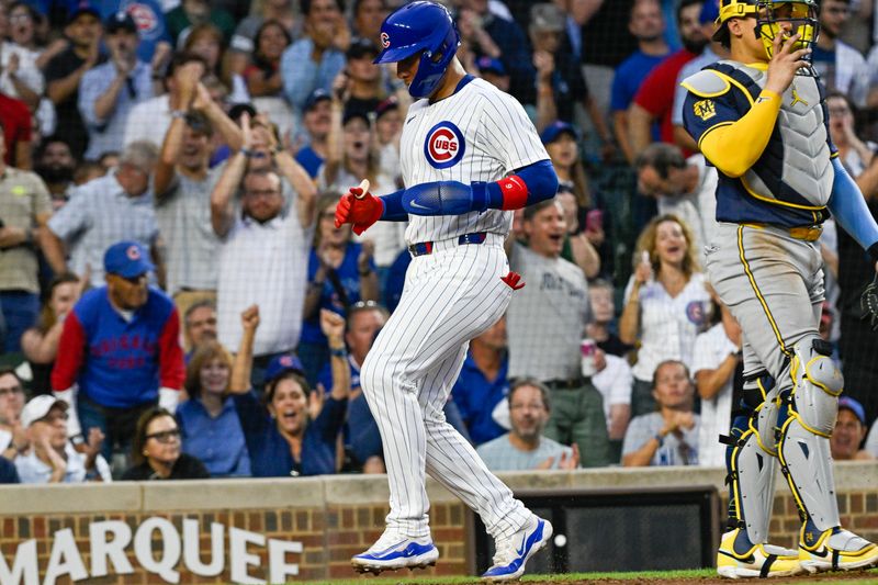 Jul 22, 2024; Chicago, Illinois, USA;  Chicago Cubs catcher Miguel Amaya (9) scores against the Milwaukee Brewers during the third inning at Wrigley Field. Mandatory Credit: Matt Marton-USA TODAY Sports