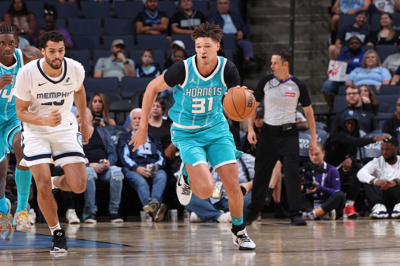 MEMPHIS, TN - OCTOBER 10: Tidjane Salaun #31 of the Charlotte Hornets dribbles the ball during the game against the Memphis Grizzlies during a NBA Preseason game on October 10, 2024 at FedExForum in Memphis, Tennessee. NOTE TO USER: User expressly acknowledges and agrees that, by downloading and or using this photograph, User is consenting to the terms and conditions of the Getty Images License Agreement. Mandatory Copyright Notice: Copyright 2024 NBAE (Photo by Joe Murphy/NBAE via Getty Images)