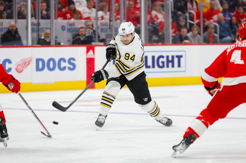 Dec 31, 2023; Detroit, Michigan, USA; Boston Bruins center Jakub Lauko (94) shoots the puck during the first period of the game between the Boston Bruins and the Detroit Red Wings at Little Caesars Arena. Mandatory Credit: Brian Bradshaw Sevald-USA TODAY Sports